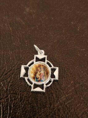 Cross pendant with a colorful center image featuring Our Lady with Child Jesus.